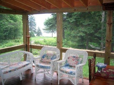 porch from inside Adirondack Lake
                    Placid New York vacation waterfront lakefront rental
                    property house home camp